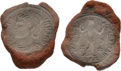 Counterfeiters' Molds and Dies ROMAN IMPERIAL. 4th Century AD. Terracotta counterfeiter's mold (23mm, 4.12 g). Part of a mold for casting coins, impressed with the obverse and reverse of a follis of G