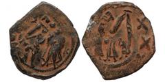 Byzantine Heraclius follis, overstruck with follis of Constans II, 7th century AD. Follis (bronze, 4.93 g, 28 mm). Obv & rev. Large M and standing figures. Nearly very fine.