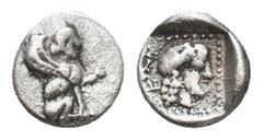 Greek DYNASTS OF LYCIA. Uvug. Uncertain mint. (Circa 470-440 BC). AR Obol. Obv: Sphinx seated right, raising forepaw. Rev: Female head right within pelleted square border; all within incuse square. SN