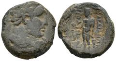Greek Lydia. Sardes. (200-100 BC). AE Bronze (16.4mm 3.4g) Obv: Laureate head of Herakles right within dotted border Rev: Apollo standing left, holding bird and olive branch; magistrate to left, ΣΑΡΔΙ