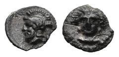 Greek CILICIA. Tarsos. Pharnabazos, Persian military commander (380-374/3 BC) AR Tetartemorion (5,9mm 0,15g) Obv: Female head facing slightly left; dolphins flanking. Rev: Bearded and helmeted male he