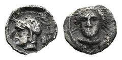 Greek CILICIA. Tarsos. Pharnabazos, Persian military commander (380-374/3 BC) AR Tetartemorion (6mm 0,14g) Obv: Female head facing slightly left; dolphins flanking. Rev: Bearded and helmeted male head