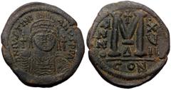 Byzantine Justinian I. AE, Follis. (Bronze 19.94 g, 35 mm) Constantinople. 527-565 AD Justinian I. AE, Follis. (Bronze 19.94 g, 35 mm) Constantinople. 527-565 AD Obv: DN IVSTINIAN[VS PP A]V[G], helmet