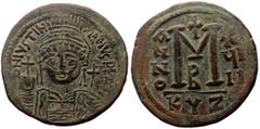 Byzantine coins Justinian I (527-565) AE Follis (Bronze, 19.70g, 35mm) Cyzicus Obv: D N IVSTINIANVS P P AVI, Helmeted and cuirassed bust of Justinian facing holding globus cruicger and shield, cross i