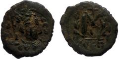 Byzantine ISLAMIC, Time of the Rashidun. Pseudo-Byzantine types. Follis (Bronze, 23mm, 5.01g) imitating a follis of Constans II, uncertain mint, circa 24/5-27/8 AH / 645-647 AD, restriked on an older 