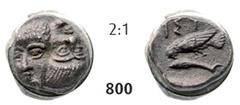 ISTROS Hemiobol (0,50g), 380-280, 1st Series Hemiobol (0,50g), 380-280, 1st Series. Av. Two young male heads facing side-by-side, the left one inverted / Rv. IΣT Sea-eagle left, grasping dolphin with 