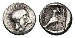 Greek Dynasts of Lycia, Uncertain dynast, AR Hemiobol, 0.27 g 6.97 mm. Circa 4th century BC. Obv: Helmeted head of Athena right. Rev: Bird (eagle?) standing right within pelleted square border; all wi