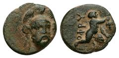 Greek Troas, Ophrynion. AE, 1.72 g 14.01 mm. 4th century BC. Obv: Helmeted head of Hektor facing slightly right. Rev: [OΦPY], Infant Dionysos kneeling right, holding grape bunch. Ref: SNG Arikantürk 7