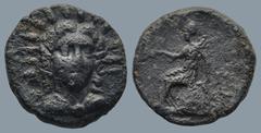 Greek LYCIA. Telmessos.(Late 3rd century-190/89 BC) AE Bronze (15mm 3,3g) Obv : Radiate and draped bust of Helios facing. Rev : TEΛMH/ΣEΩN. Apollo seated left on omphalos, holding bow in left hand and