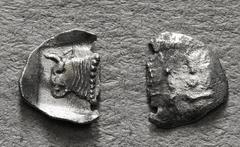 Greek Coins LYCIA or CARIA. Uncertain. Tetartemorion (Circa 5th century BC). Obv: Forepart of bull left within incuse square; Lycian (?) letters above. Rev: Plain 0,25 g