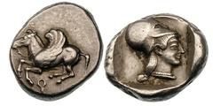 CORINTHIA. Corinth. Ca. 475 BC. Silver stater (8.60 gm). Pegasus ﬂying left, koppa below / Head of Athena right, hair in long queue, wearing Corinthian helmet pushed back on head and pearl necklace, w