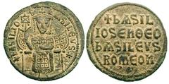 BYZANTINE EMPIRE. Basil I (867-886). Bronze follis (7.08 gm). Constantinople, ca. 879-886. +bASILIO—S — bASILEVS*, emperor seated facing on throne with upholstered canoe-shaped back, wearing crown wit