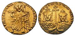 BYZANTINE EMPIRE. Basil I (AD 867–886). AV solidus (4.33 gm). Constantinople, AD 868–879. Nimbate Christ enthroned facing, raising hand in benediction and holding book of Gospels / Facing busts of Bas