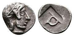 Greek Ionia, Kolophon. Circa 450-410 BC. AR Tetartemorion (8 mm, 0.32 g.). Head of Apollo to right wearing a laurel wreath on his helmet with a neck and cheek guard. Rev. Monogram of ΤΡ (retrograde) w