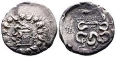 Greek Lydia,Tralleis, circa 140-135 BC. AR Cistophoric Tetradrachm (26 mm, 12,13 g.), struck under the magistrate Dion Cista Mystica from which snake coils; around, ivy wreath with fruits. Rev. Two sn