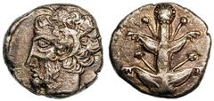 CYRENAICA. Cyrene. Later fourth century BC. Silver tetradrachm (13.14 gm). Silphium plant / Head of Zeus Ammon left. Cf. BMC 80, pl. x, 6 (with magistrate's signature on reverse). Toned. Very fine Est