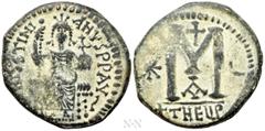 Byzantine Coins JUSTINIAN I (527-565). Follis. Antioch. Obv: D N IVSTINIANVS P P AVG. Justinian enthroned facing, holding long sceptre and globe cruciger. Rev: Large M between star and crescent; above