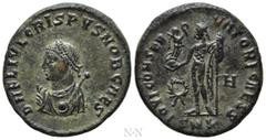 Roman Imperial Coins CRISPUS (316-326). Follis. Cyzicus. Obv: D N FL IVL CRISPVS NOB CAES. Laureate and draped bust left, holding mappa and globe, sceptre over shoulder. Rev: IOVI CONSERVATORI CAESS /