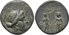 LYDIA. Magnesia ad Sipylum. Ae (2nd-1st centuries BC). Obv: Diademed head of Artemis right, bow and quiver over shoulder. Rev: ΣΙΠΥΛΟΥ. Two male figures standing vis-à-vis, holding scepter between the