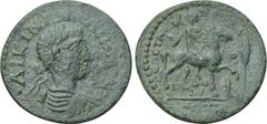 LYDIA. Mostene. Gallienus (253-268). Ae. Obv: ΛΙΚΙΝ ΓΑΛΛΙΗΝΟC. Laureate, draped and cuirassed bust right. Rev: ЄΠ CΤΡΑVΡ SЄVSIΔ OCΠT ΛOVIA ΔOV MOCTH. Horseman right, holding labrys; cypress tree to ri