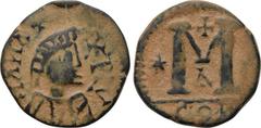 MIGRATION PERIOD. Imitating a Byzantine follis (5th-8th centuries AD). Obv: Helmeted and draped bust right; around, pseudo-legend. Rev: Large M; in left field, star; above, cross; below, Δ; in exergue