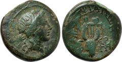 LYDIA. Kaystrianoi. Ae (2nd-1st centuries BC). Obv: Head of Dionysos right, wearing ivy wreath. Rev: ΚΑΥCΤΡΙΑΝΩΝ. Lyre, with base terminating in boukranion; monogram to left and right. Cf. SNG von Aul