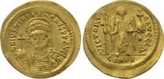 Byzantine Coins JUSTINIAN I (527-565). GOLD Solidus. Constantinople. Obv: D N IVSTINIANVS P P AVG. Helmeted and cuirassed bust facing, holding globus cruciger and shield with horseman motif. Rev: VICT