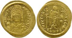 Byzantine Coins JUSTINIAN I (527-565). GOLD Solidus. Constantinople. Obv: D N IVSTINIANVS P P AVG. Helmeted and cuirassed bust facing, holding globus cruciger and shield with horseman motif. Rev: VICT