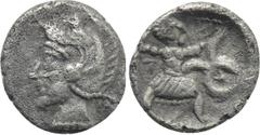Greek Coins UNCERTAIN LEVANT. Tetartemorion (Circa 4th century BC). Obv: Helmeted head (of Athena?) left. Rev: Slinger in throwing stance right; monogram to right; all within linear border within incu