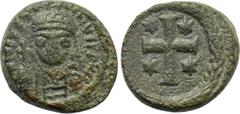 Byzantine Coins JUSTINIAN I (527-565). Decanummium. Ravenna. Obv: D N IVSTINIANVS P P AV. Helmeted and cuirassed facing bust, holding globus cruciger and shield. Rev: Large cross, with star in each an