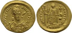 Byzantine Coins JUSTINIAN I (527-565). GOLD Solidus. Constantinople. Obv: D N IVSTINIANVS P P AVG. Helmeted and cuirassed bust facing slightly right, holding spear and shield decorated with horseman m