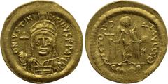 Byzantine Coins JUSTINIAN I (527-565). GOLD Solidus. Constantinople. Obv: D N IVSTINIANVS P P AVG. Helmeted and cuirassed bust facing, holding globus cruciger and shield with horseman motif. Rev: VICT