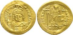 Byzantine Coins JUSTINIAN I (527-565). GOLD Solidus. Constantinople. Obv: D N IVSTINIANVS P P AVG. Helmeted and cuirassed bust facing, holding globus cruciger and shield with horseman motif. Rev: VICT