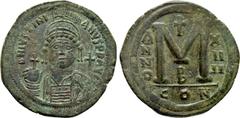 Byzantine Coins JUSTINIAN I (527-565). Follis. Constantinople. Dated RY 24 (550/1). Obv: D N IVSTINIANVS P P AVG. Helmeted, draped and cuirassed bust facing, holding globus cruciger and shield decorat