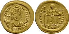 Byzantine Coins JUSTINIAN I (527-565). GOLD Solidus. Constantinople. Obv: D N IVSTINIANVS P P AVG. Helmeted and cuirassed bust facing, holding globus cruciger and shield with horseman motif. Rev: VICT