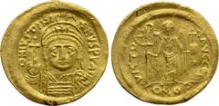 Byzantine Coins JUSTINIAN I (527-565). GOLD Solidus. Constantinople. Obv: D N IVSTINIANVS P P AVG. Helmeted and cuirassed bust facing, holding globus cruciger and shield with horseman motif. Rev: VICT