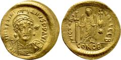 Byzantine Coins JUSTINIAN I (527-565). GOLD Solidus. Constantinople. Obv: D N IVSTINIANVS P P AVG. Helmeted and cuirassed bust facing slightly right, holding spear and shield decorated with horseman m