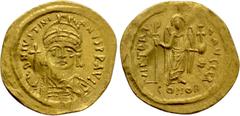 Byzantine Coins JUSTINIAN I (527-565). GOLD Solidus. Constantinople. Obv: D N IVSTINIANVS P P AVG. Helmeted and cuirassed bust facing, holding globus cruciger and shield with horseman motif. Rev: VICT