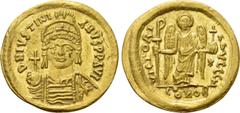 Byzantine Coins JUSTINIAN I (527-565). GOLD Solidus. Constantinople. Obv: D N IVSTINIANVS P P AVG. Helmeted and cuirassed bust facing, holding globus cruciger and shield with horseman motif. Rev: VICT