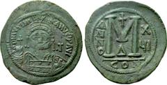 Byzantine Coins JUSTINIAN I (527-565). Follis. Constantinople. Dated RY 16 (542/3). Obv: D N IVSTINIANVS P P AVG. Helmeted and cuirassed bust facing, holding globus cruciger and shield decorated with 