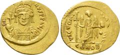 Byzantine Coins JUSTINIAN I (527-565). GOLD Solidus. Constantinople. Obv: D N IVSTINIANVS P P AVG. Helmeted and cuirassed bust facing, holding globus cruciger and shield decorated with horseman motif.