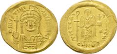 Byzantine Coins JUSTINIAN I (527-565). GOLD Solidus. Constantinople. Obv: D N IVSTINIANVS P P AVG. Helmeted and cuirassed bust facing, holding globus cruciger and shield decorated with horseman motif.