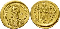 Byzantine Coins JUSTINIAN I (527-565). GOLD Solidus. Constantinople. Obv: D N IVSTINIANVS P P AVG. Helmeted and cuirassed bust facing slightly right, holding spear and shield decorated with horseman m