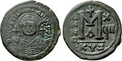 Byzantine Coins JUSTINIAN I (527-565). Follis. Cyzicus. Dated RY 17 (553/4). Obv: D N IVSTINIANVS P P AVG. Helmeted and cuirassed bust facing, holding globus cruciger and shield decorated with horsema