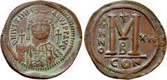 Byzantine Coins JUSTINIAN I (527-565). Follis. Constantinople. Dated RY 12 (538/9). Obv: D N IVSTINIANVS P P AVG. Helmeted and cuirassed bust facing, holding globus cruciger and shield decorated with 