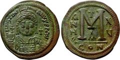 Byzantine Coins JUSTINIAN I (527-565). Follis. Constantinople. Dated RY 15 (541/2). Obv: D N IVSTINIANVS P P AVG. Helmeted and cuirassed bust facing, holding globus cruciger and shield decorated with 