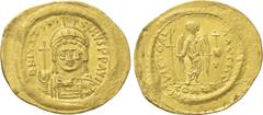 Byzantine Coins JUSTINIAN I (527-565). GOLD Solidus. Constantinople. Obv: D N IVSTINIANVS P P AVG. Helmeted and cuirassed bust facing, holding globus cruciger and shield decorated with horseman motif.