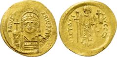 Byzantine Coins JUSTINIAN I (527-565). GOLD Solidus. Constantinople. Obv: D N IVSTINIANVS P P AVG. Helmeted and cuirassed bust facing, holding globus cruciger and shield decorated with horseman motif.