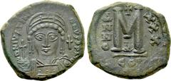 Byzantine Coins JUSTINIAN I (527-565). Follis. Constantinople. Dated RY 30 (556/7). Obv: D N IVSTINIANVS P P AVG. Helmeted and cuirassed bust facing, holding globus cruciger and shield decorated with 