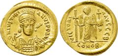 Byzantine Coins JUSTINIAN I (527-565). GOLD Solidus. Constantinople. Obv: D N IVSTINIANVS P P AVG. Helmeted and cuirassed bust facing slightly right, holding spear and shield decorated with horseman m